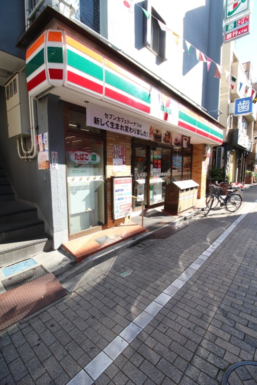 セブンイレブン東十条駅前店(コンビニ)まで300m 町田荘