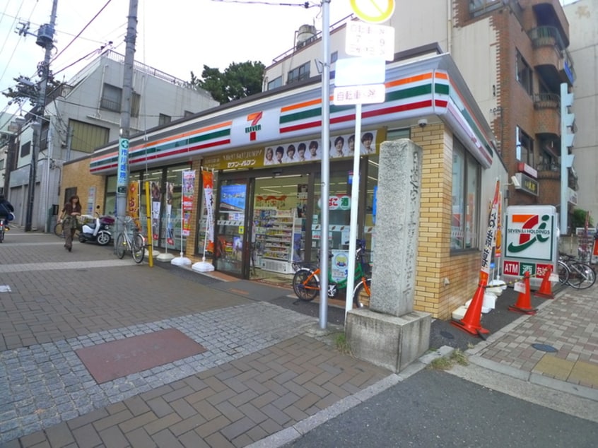 セブンイレブン(コンビニ)まで350m 龍ハイツ