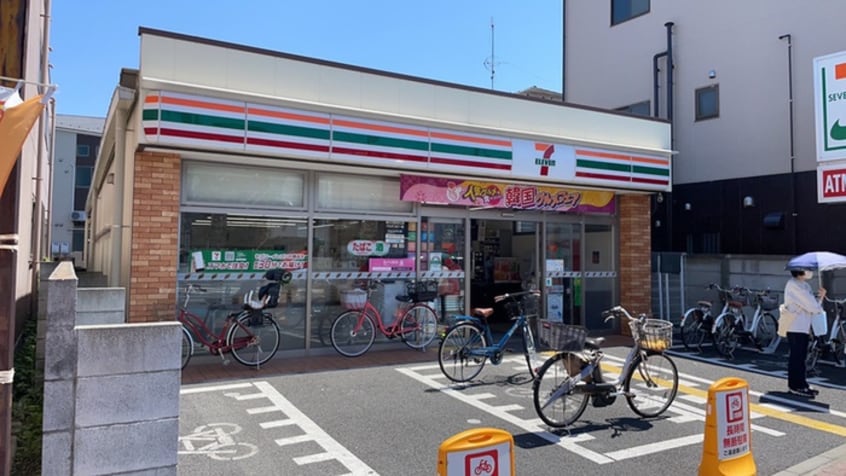 セブンイレブン(コンビニ)まで103m ハーモニーテラス西竹ノ塚