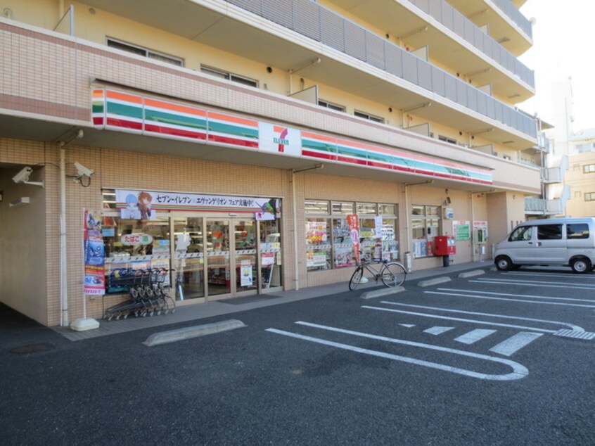 セブンイレブン(コンビニ)まで450m パナメント多摩Ⅱ