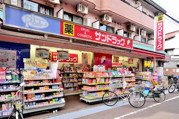 サンドラッグ一橋学園店(ドラッグストア)まで2m オオサワビル