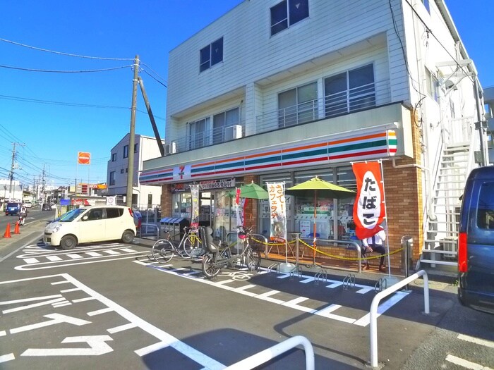 セブンイレブン市川曽谷店(コンビニ)まで270m 亀井マンション