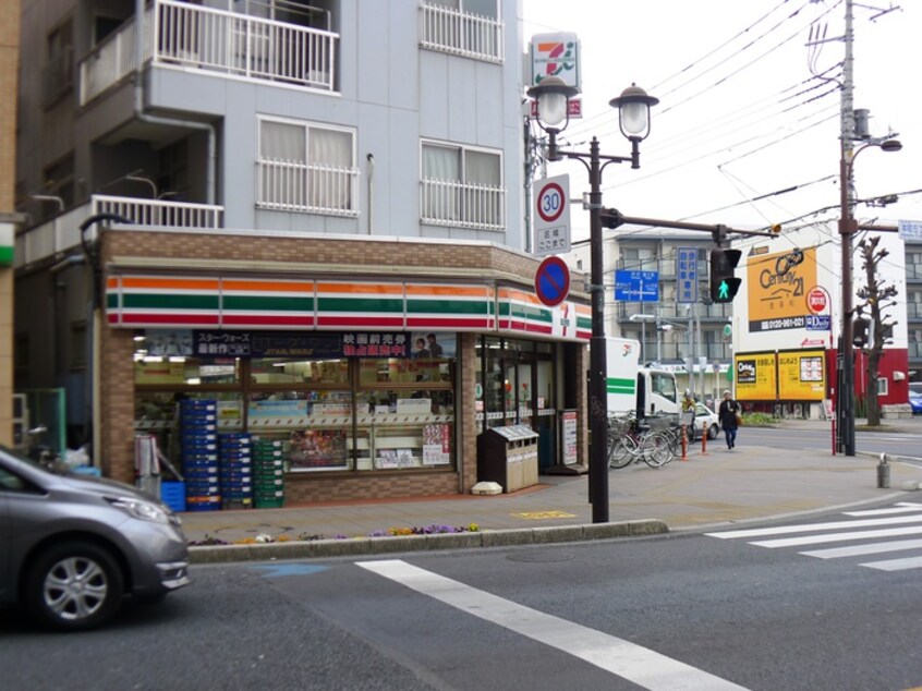 7イレブン(コンビニ)まで450m フラワ－ハイツ