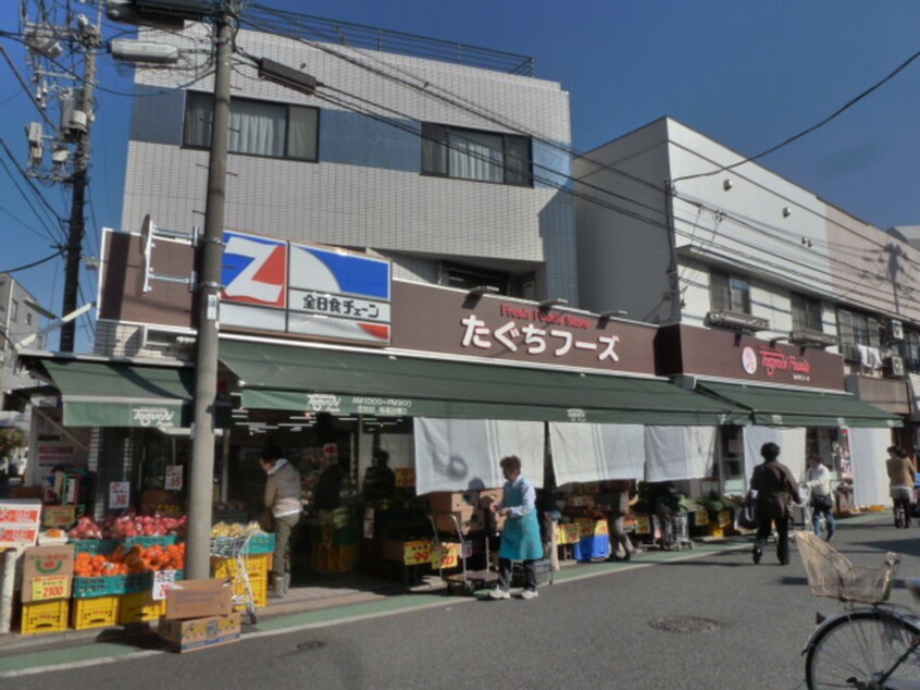 たぐちフーズ(スーパー)まで475m 日興狛江マンション２