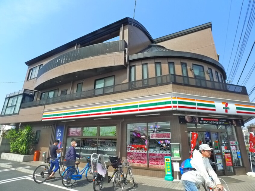 セブンイレブン足立島根店(コンビニ)まで423m シャトーテル寿2