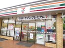 セブンイレブン万田店(コンビニ)まで411m ジュネスコ－ト飛鳥Ｃ