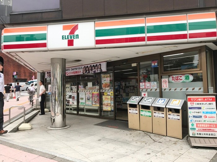 セブン-イレブン 港区飯倉店(コンビニ)まで414m ディームス麻布狸穴町