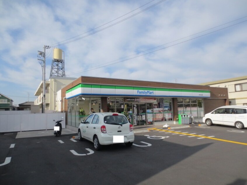 ファミリーマート男山金振店(コンビニ)まで402m 男山第二住宅第１０９号棟(401)