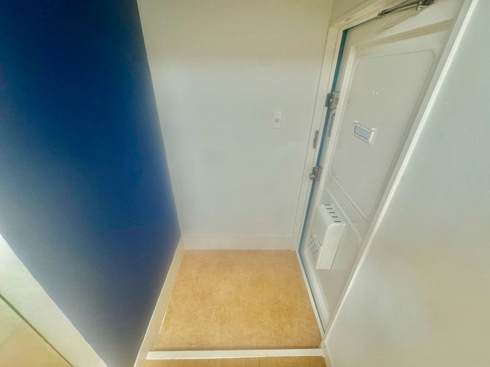 玄関 三富王子マンション