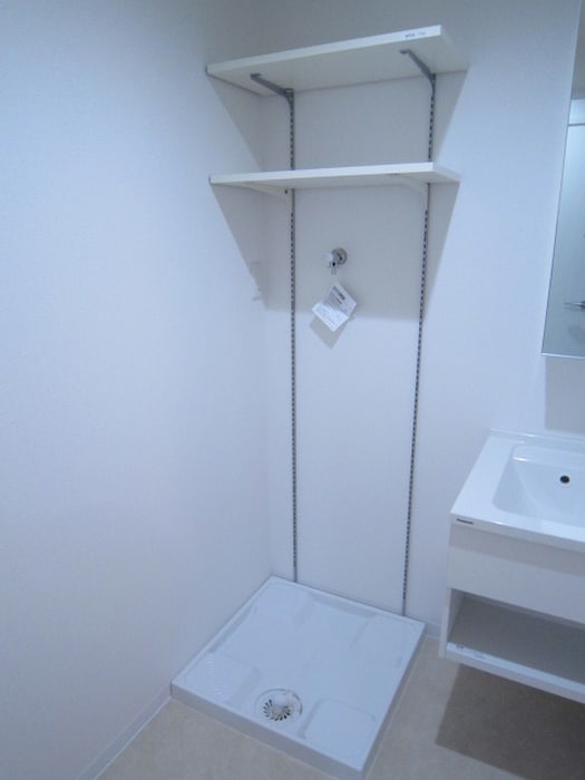 洗濯機置場 アヴェニール千里丘東