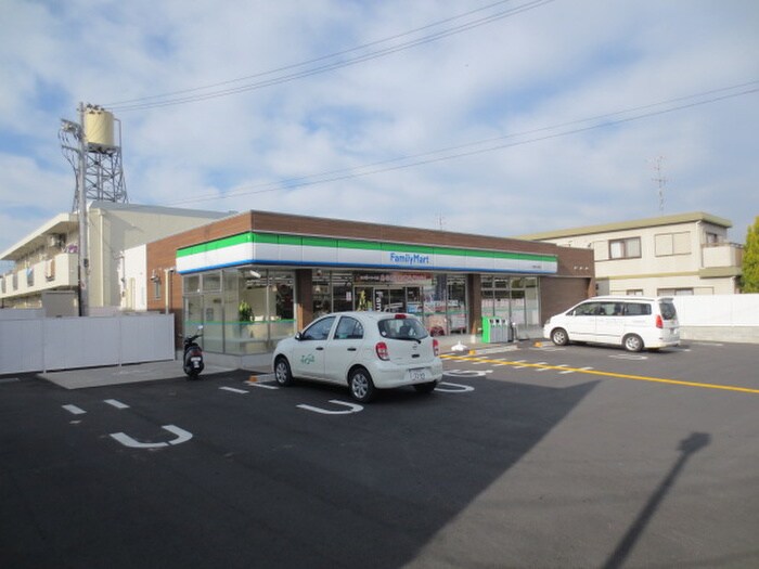 ファミリーマート男山金振店(コンビニ)まで52m 男山ハイツＡ棟