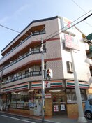 セブンイレブン寝屋川萱島南店(コンビニ)まで98m 本町ハイツ