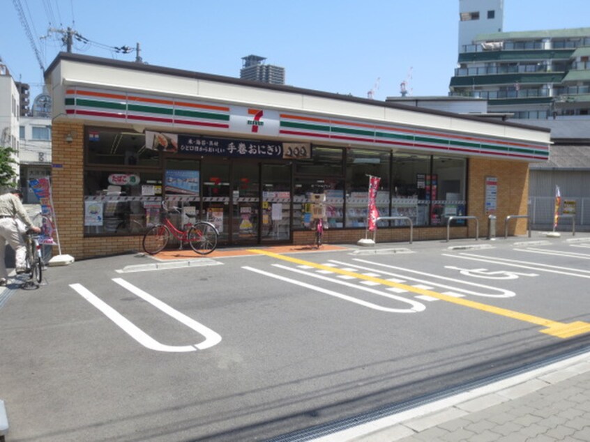 セブンイレブン(スーパー)まで8m ﾌﾟﾚｻﾝｽ大阪ｹﾞｰﾄｼﾃｨ(1203)