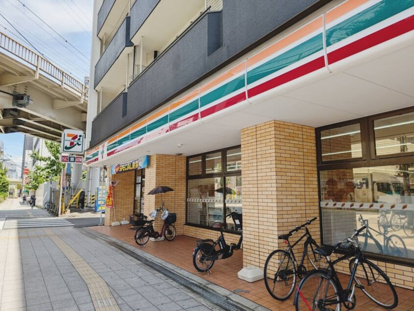 セブンイレブン(コンビニ)まで215m ｴｽﾃﾑｺ-ﾄ大阪ﾍﾞｲｴﾘｱ(404)