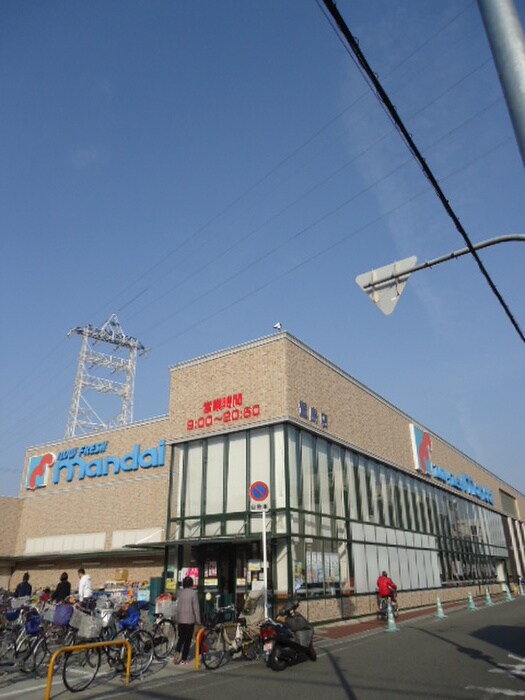 万代萱島店(スーパー)まで1200m フレアコ－ト・コスモ