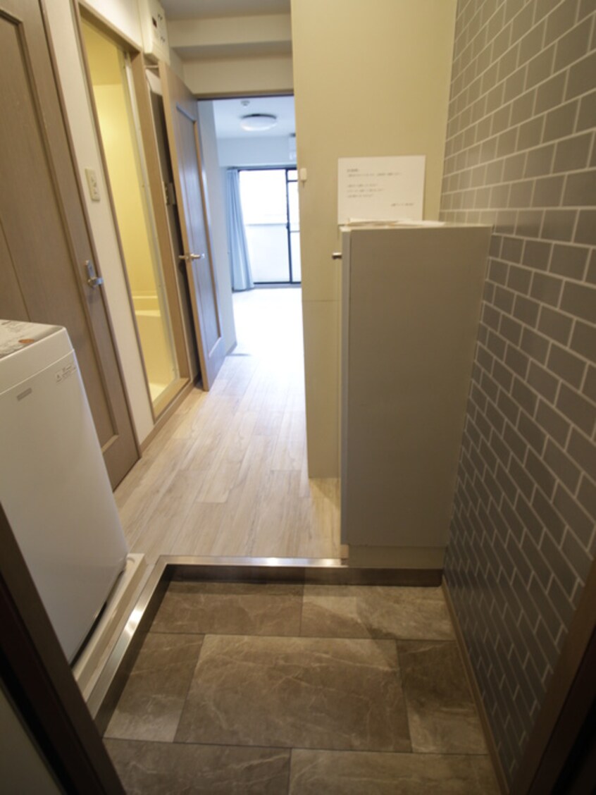 玄関 ペブルコート楠葉