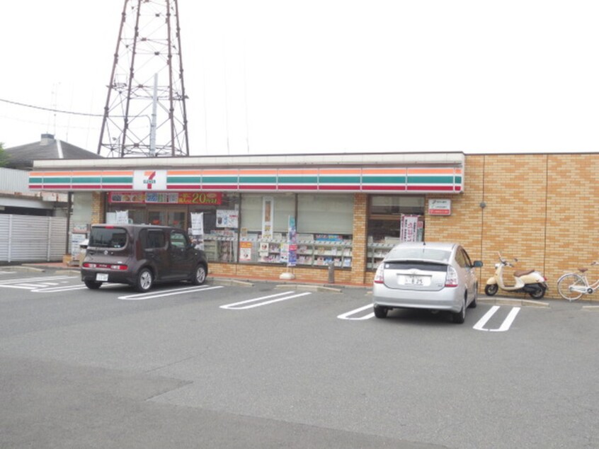 セブンイレブン(コンビニ)まで910m 東香里野村マンション