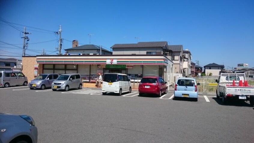 セブンイレブン西江井島店(コンビニ)まで1100m サンエクセル江井ヶ島(106)