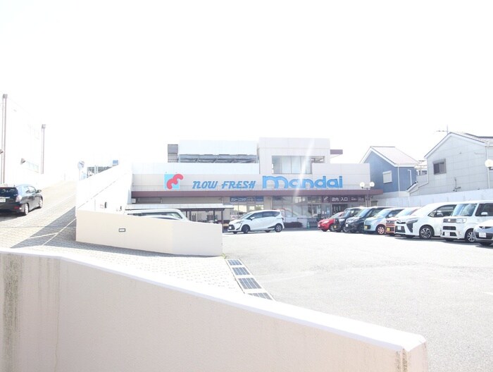 万代(スーパー)まで600m プランドール