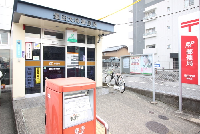 豊田大林郵便局(郵便局)まで1090m ヘリテージ