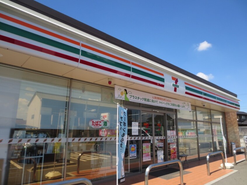 セブンイレブン江南藤里店(コンビニ)まで450m プルメリアＹ