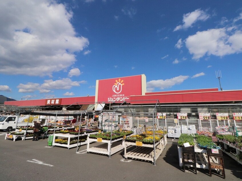 ジュンテンドー(電気量販店/ホームセンター)まで1300m タウニー平良Ａ・Ｂ棟