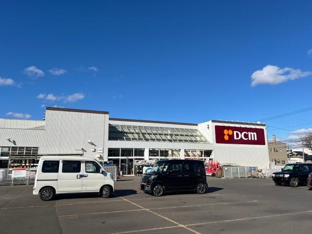 DCM中園店(電気量販店/ホームセンター)まで1181m 拓穂ハイツ（愛国東2-6-23）