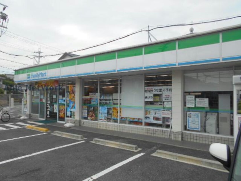 ファミリーマート富田林津々山台店(コンビニ)まで487m アルファコート