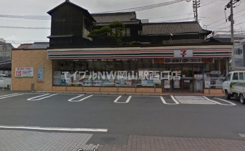 セブンイレブン岡山弓之町店(コンビニ)まで394m 石関マンション