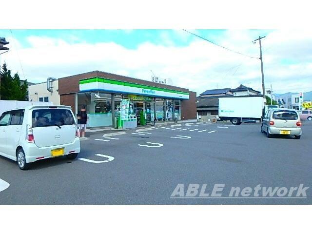 ファミリーマート八代田中東町店(コンビニ)まで698m プレサスⅡ