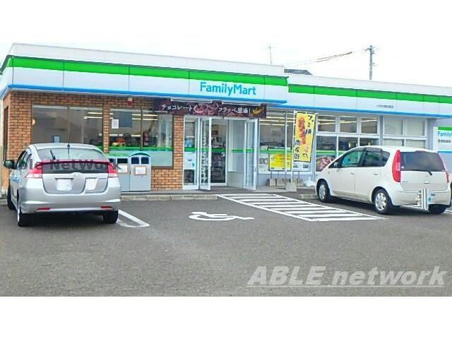 ファミリーマート八代古閑中町店(コンビニ)まで1046m デリス・シャルマンⅡ