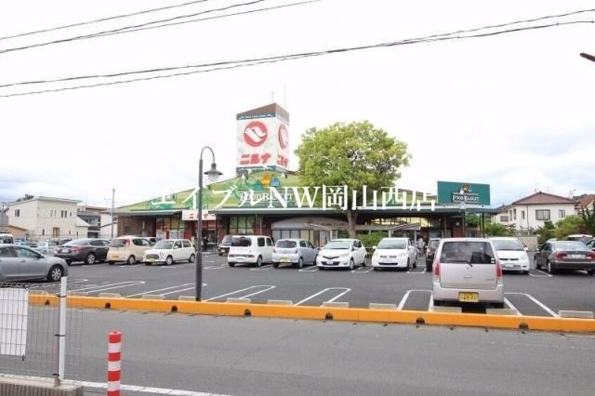ニシナフードバスケット三門店(スーパー)まで397m アビタ山本岡山
