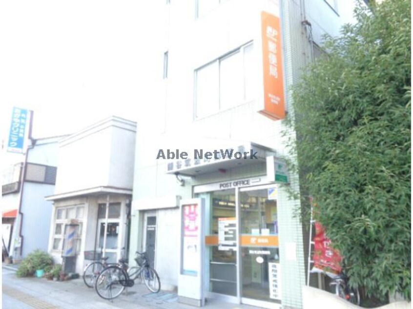 熊谷筑波町郵便局(郵便局)まで1260m マンションタカノ（熊谷市平戸）