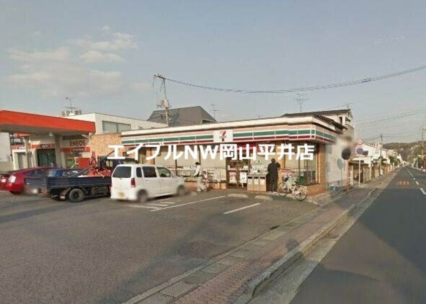 セブンイレブン岡山門田屋敷4丁目店(コンビニ)まで1168m トラヴァーサル・ハイツ