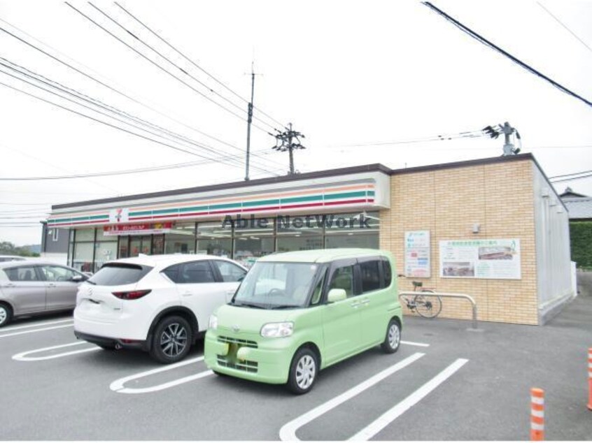 セブンイレブン諫早唐比東店(コンビニ)まで1410m ベルメゾン　Ａ