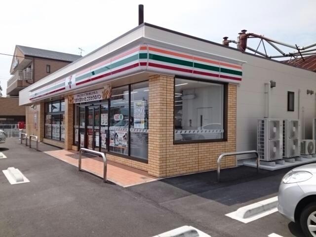 セブンイレブン西予宇和町卯之町店(コンビニ)まで596m シャン・ド・フルール　K