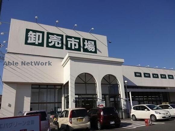 ジャパンミート卸売市場古河店(スーパー)まで1246m ファミリーハイツB