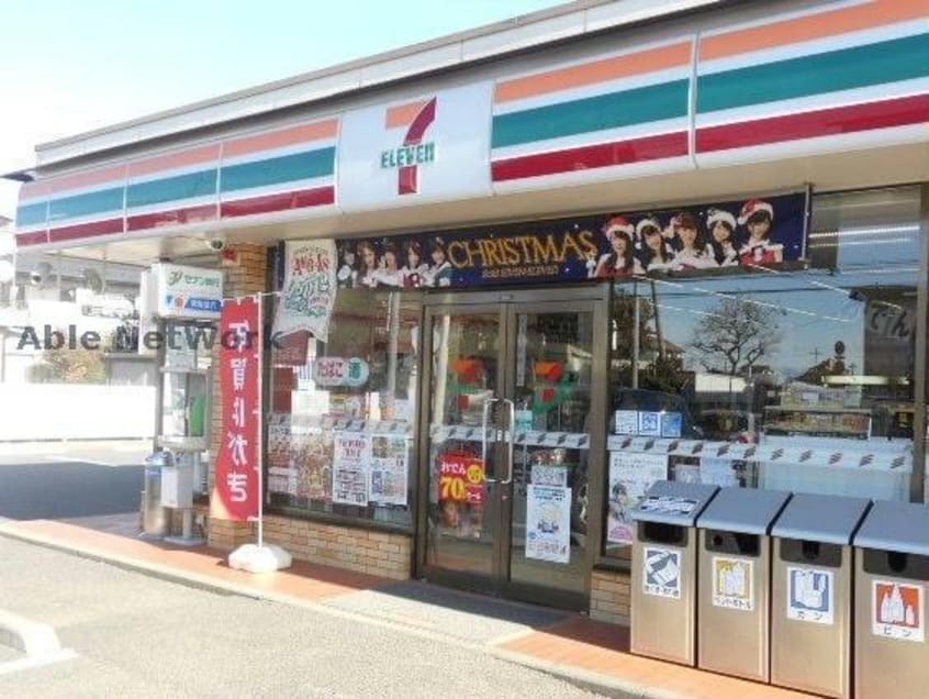 セブンイレブン古河新中田店(コンビニ)まで727m スパニッシュガーデンD