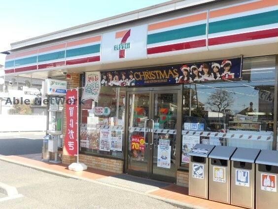 セブンイレブン古河新中田店(コンビニ)まで1081m 大山ニューライズⅡ