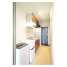 玄関から続くキッチンスペース グランピア１６