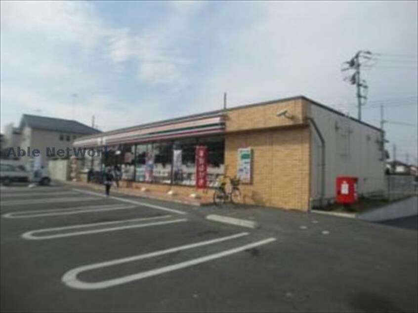 セブンイレブン加須旗井西店(コンビニ)まで686m シャン・ド・フルール