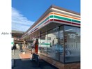 セブンイレブン久喜栗橋東1丁目店(コンビニ)まで677m プラシードⅠ番館