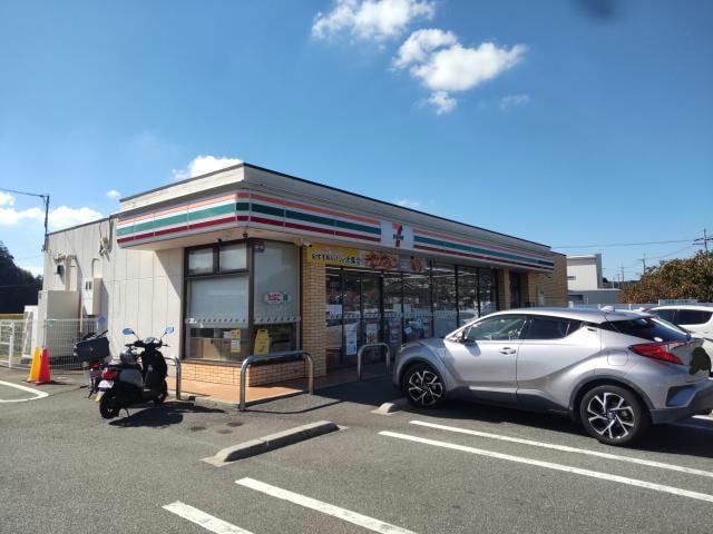 セブンイレブン三田下井沢店(コンビニ)まで1058m ブランシェ・ドミール A棟