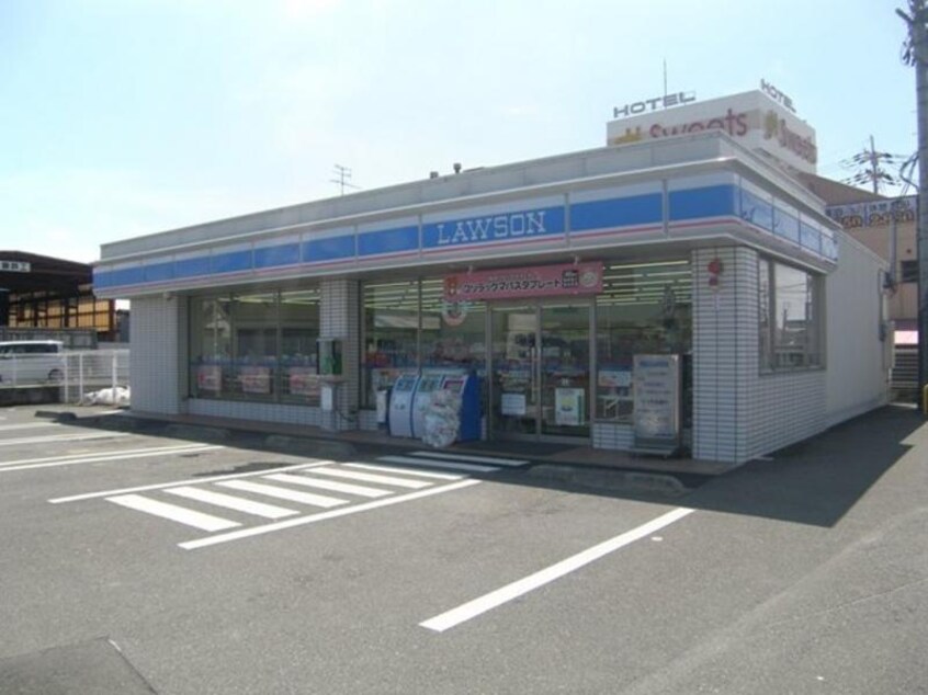 ローソン八幡下奈良店(コンビニ)まで590m エトワールシャトー
