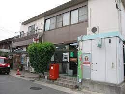 木津南垣外郵便局(郵便局)まで1091m クローバー