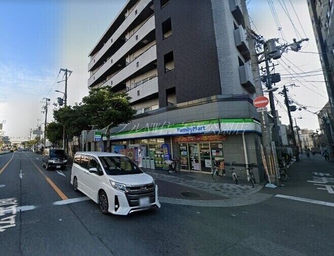 ファミリーマート西成区役所前店(コンビニ)まで489m 永田マンション